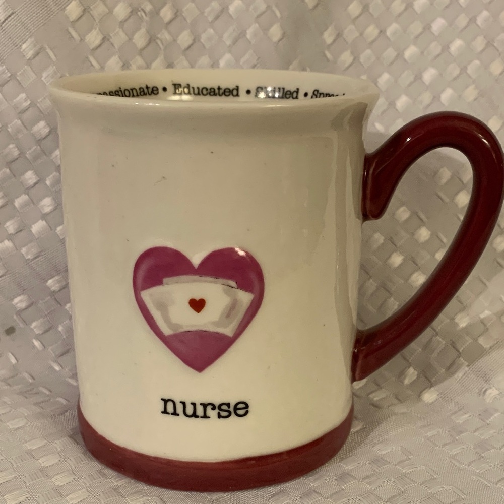 Nurse Heart ceramic mug with phrases describing a nurse’s qualities around rim.